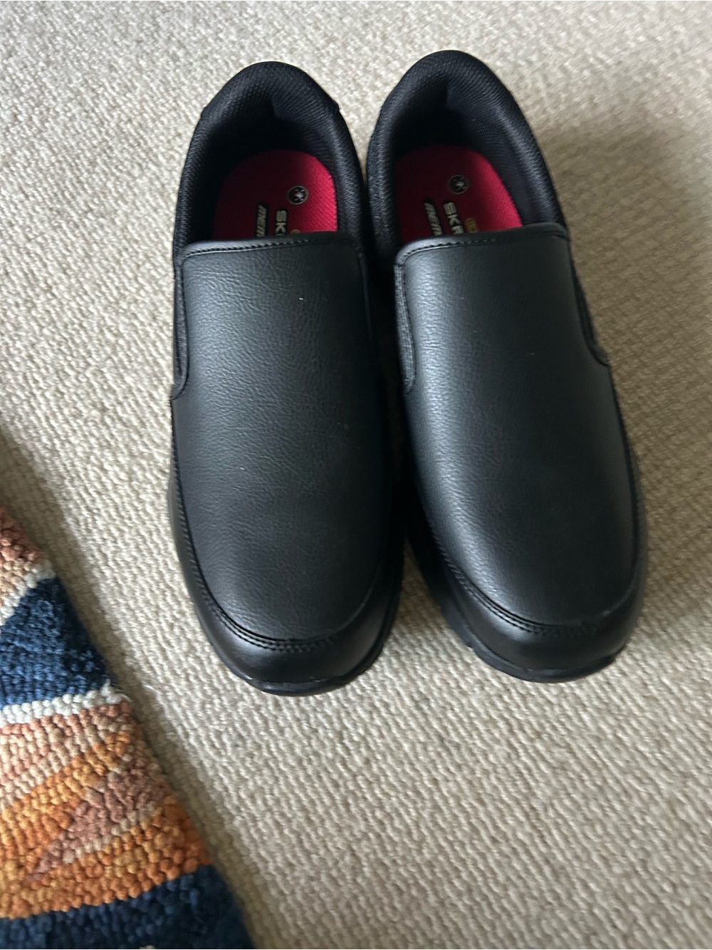 Skechers Black Slip-On Comfort Loafers with Red Insole